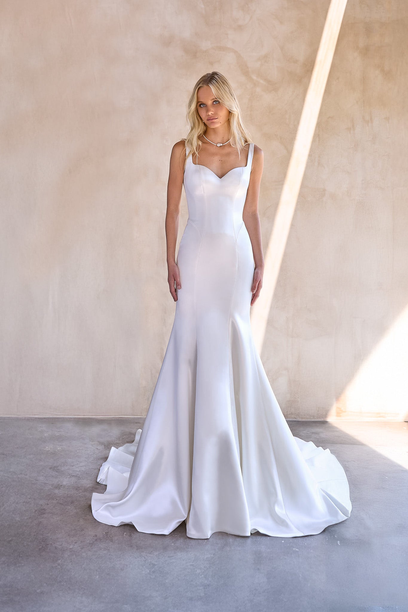 Mermaid silhouette of The Bryde's Jaya gown, accentuating curves elegantly.