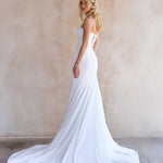 back Image of the June Wedding dress by The Bryde, with no detachable bow. made from crepe main fabric and a soft chiffon angled skirt